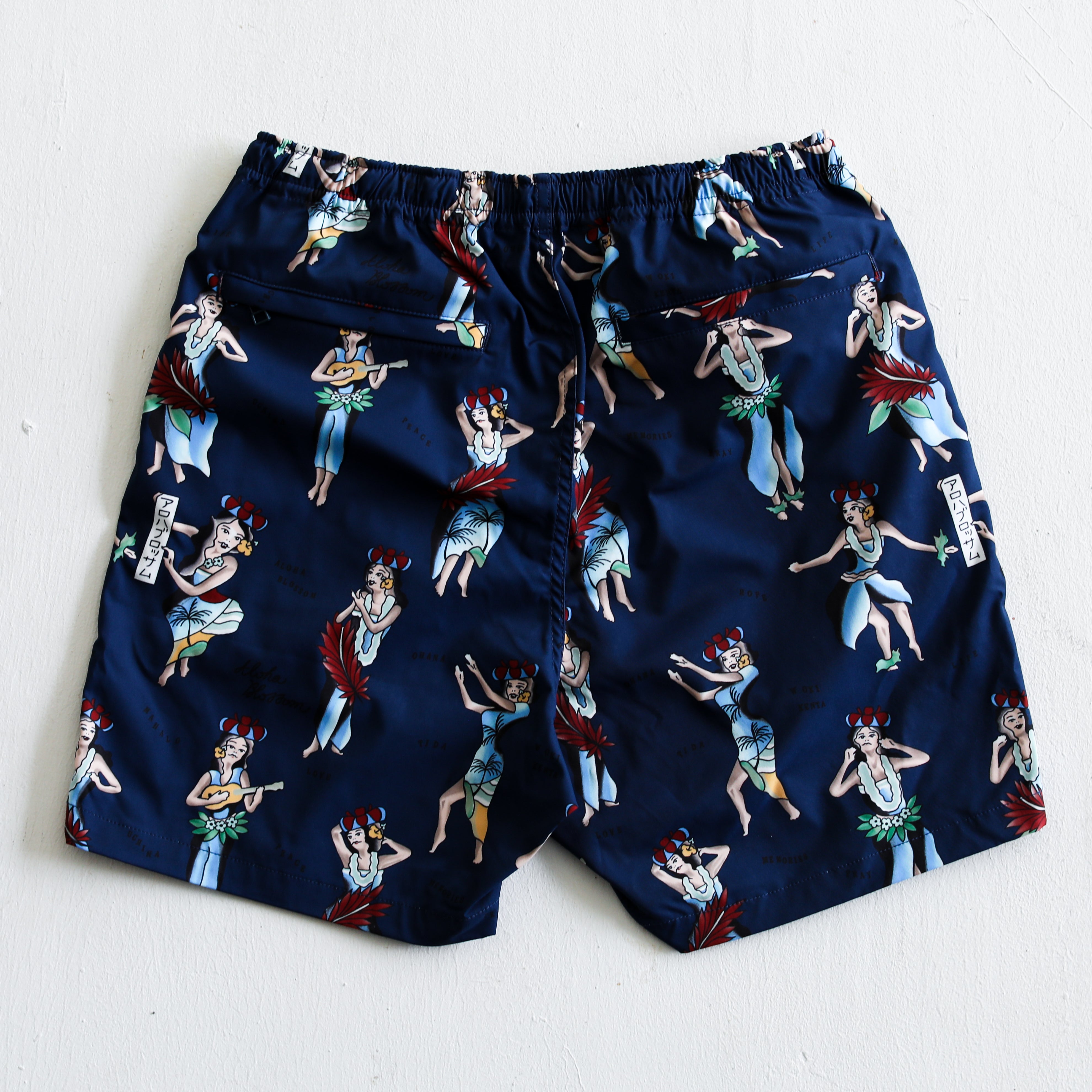Aloha Blossom × SHIGIRA SEVEN MILES RESORT HULA GIRL BEACH SHORTS